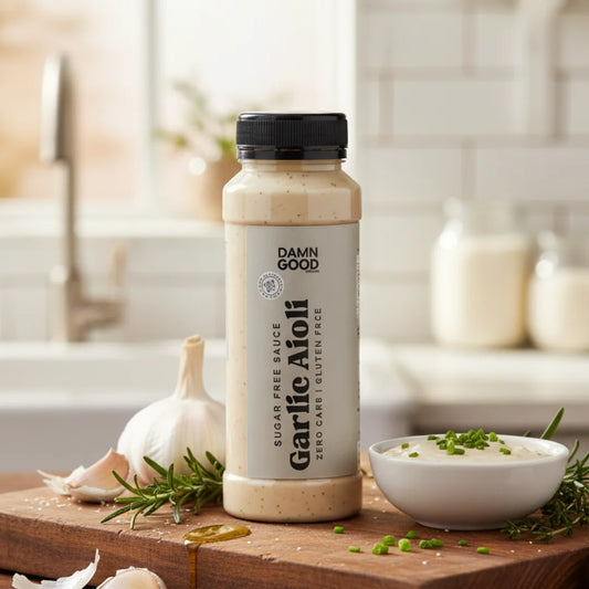 Damn Good Garlic Aioli on a kitchen counter with natural ingredients