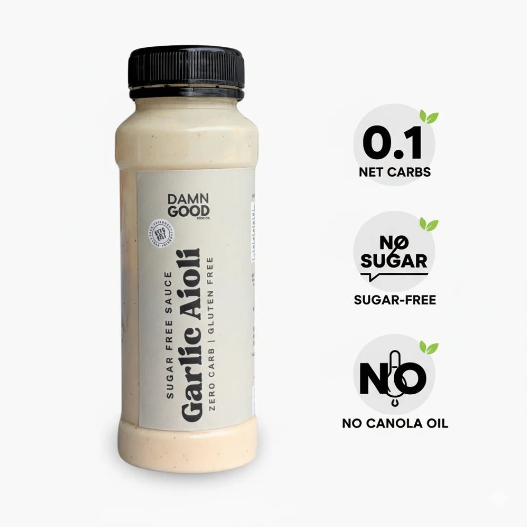 Professional product shot of the Damn Good Garlic Aioli Sauce bottle on white, clearly marked with callouts for 0.1 Net Carbs, Sugar-Free, and Keto-Friendly. Designed for clear e-commerce display.
