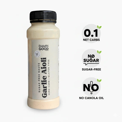 Professional product shot of the Damn Good Garlic Aioli Sauce bottle on white, clearly marked with callouts for 0.1 Net Carbs, Sugar-Free, and Keto-Friendly. Designed for clear e-commerce display.